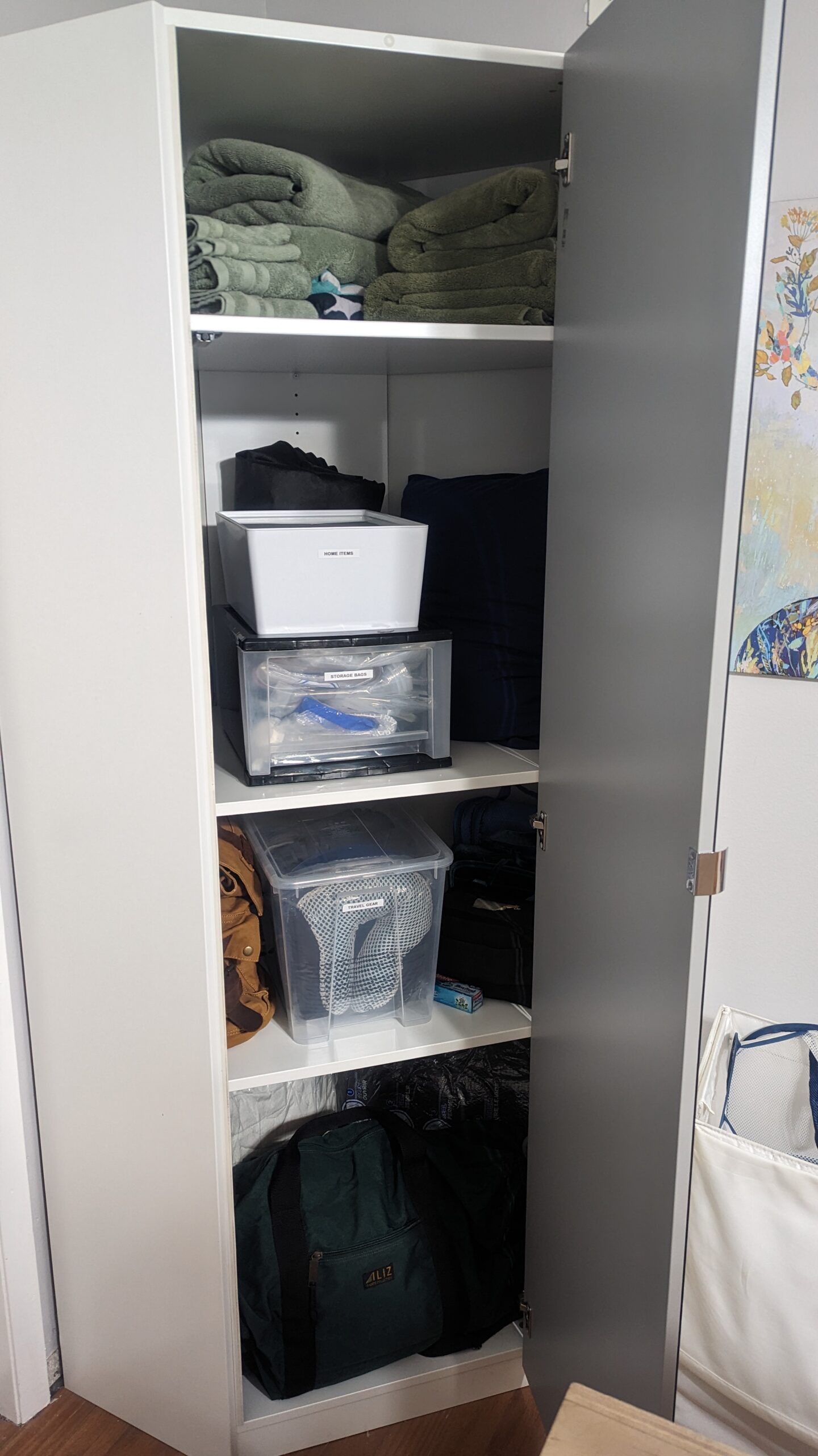 An "after" picture of an organized corner cabinet. 